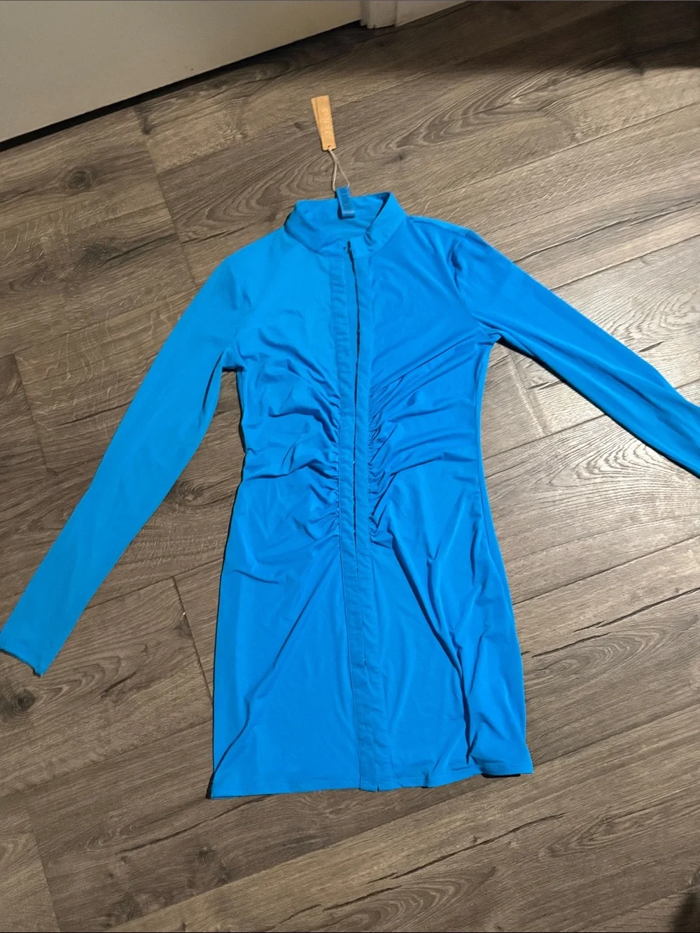 SKIMS Long Sleeve Ruched Front Dress in bright blue. Turquoise